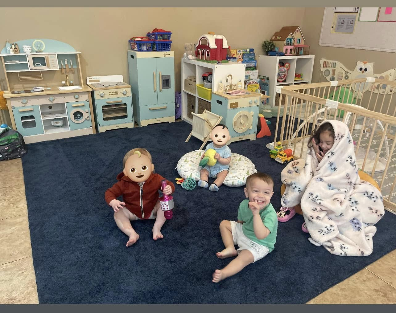 Children playing in our cozy daycare playroom